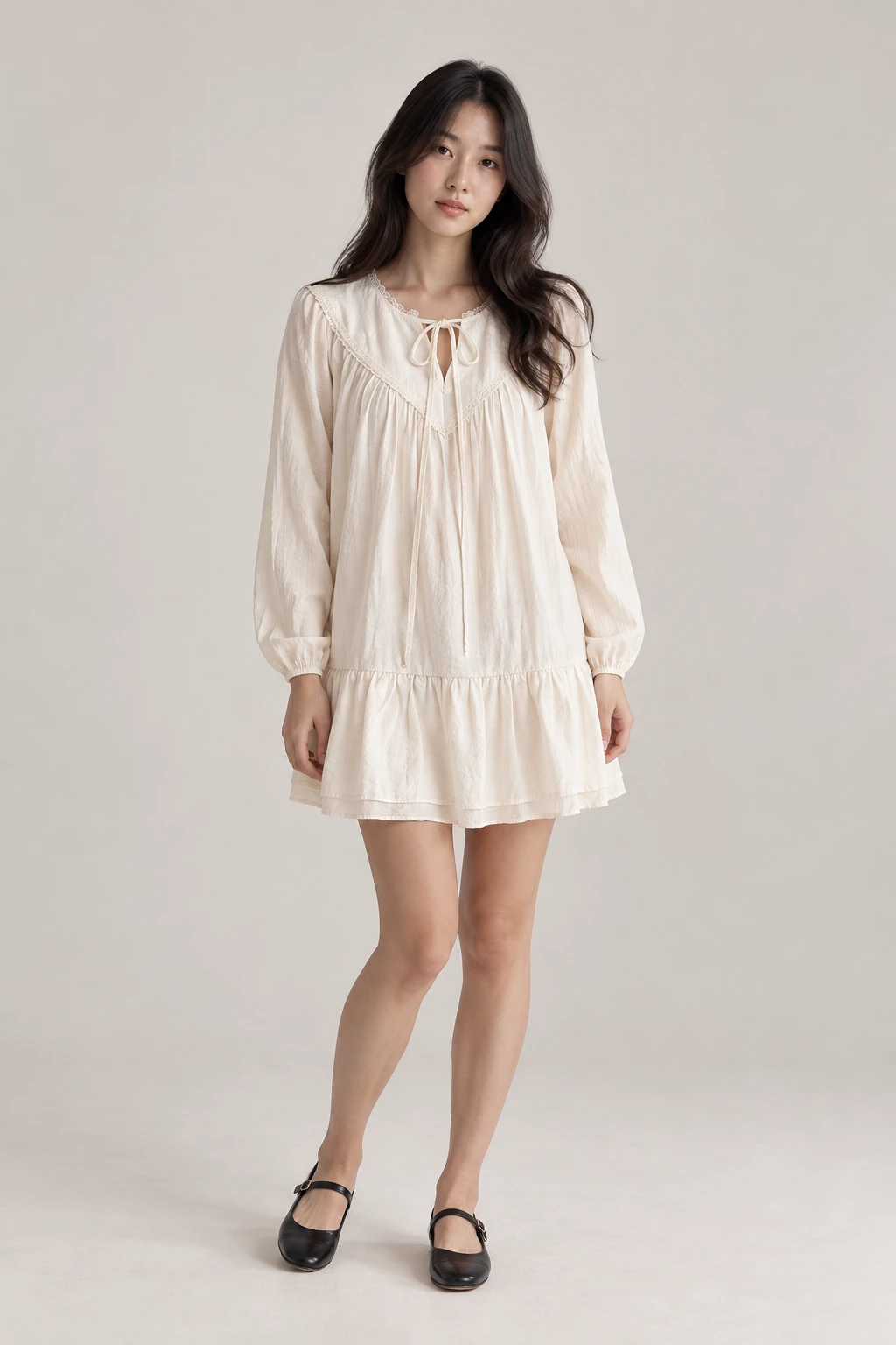 Korean model wearing the white lace-trimmed smock mini dress with a ribbon neckline and black Mary Jane flats